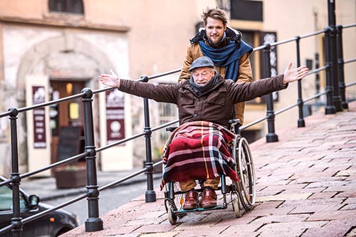 Man being pushed in wheelchair