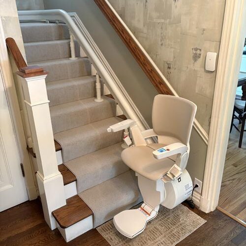 Otolift Modul-Air Smart Curved Stair Lift Parked at Bottom