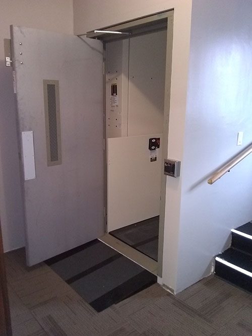 Commercial-wheelchair-lift-with-door-open Commercial wheelchair lift with door open
